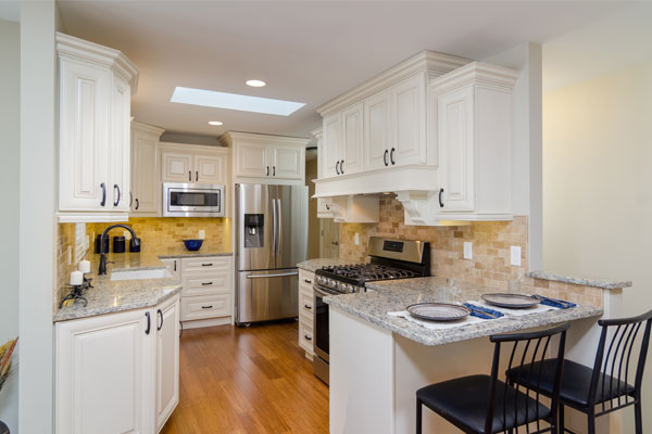 kitchen with white cabinets and granite countertops