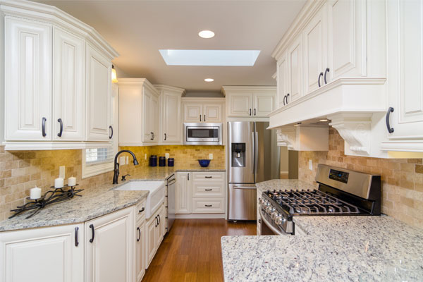 kitchen with white cabinets and granite countertops