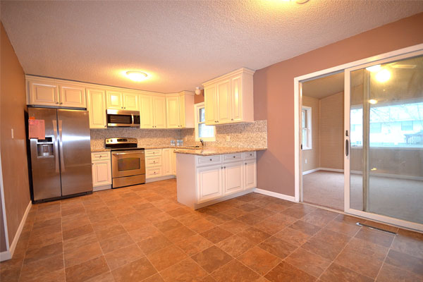 kitchen with white cabinets and granite countertops