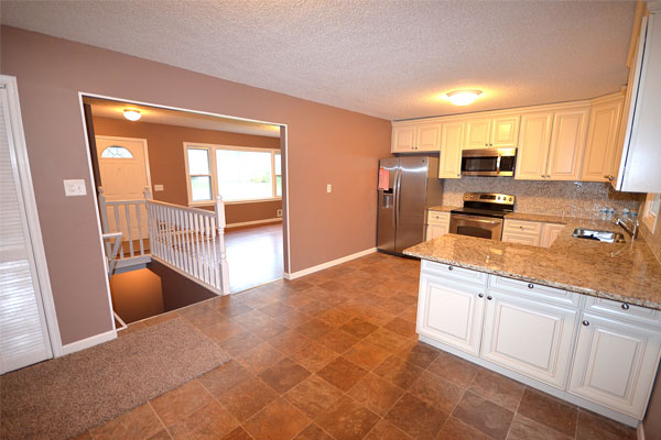 kitchen with white cabinets and granite countertops
