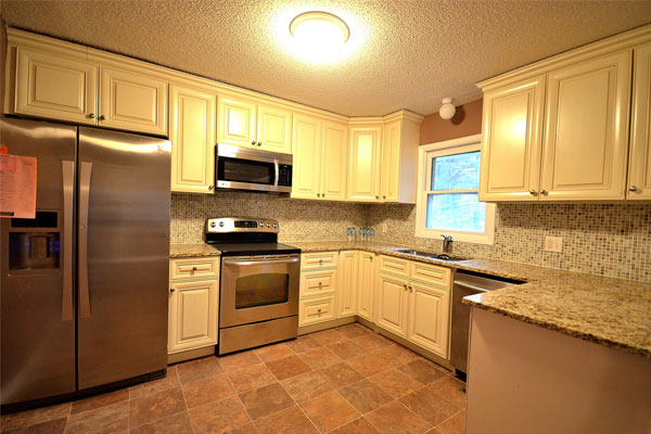 kitchen with white cabinets and granite countertops